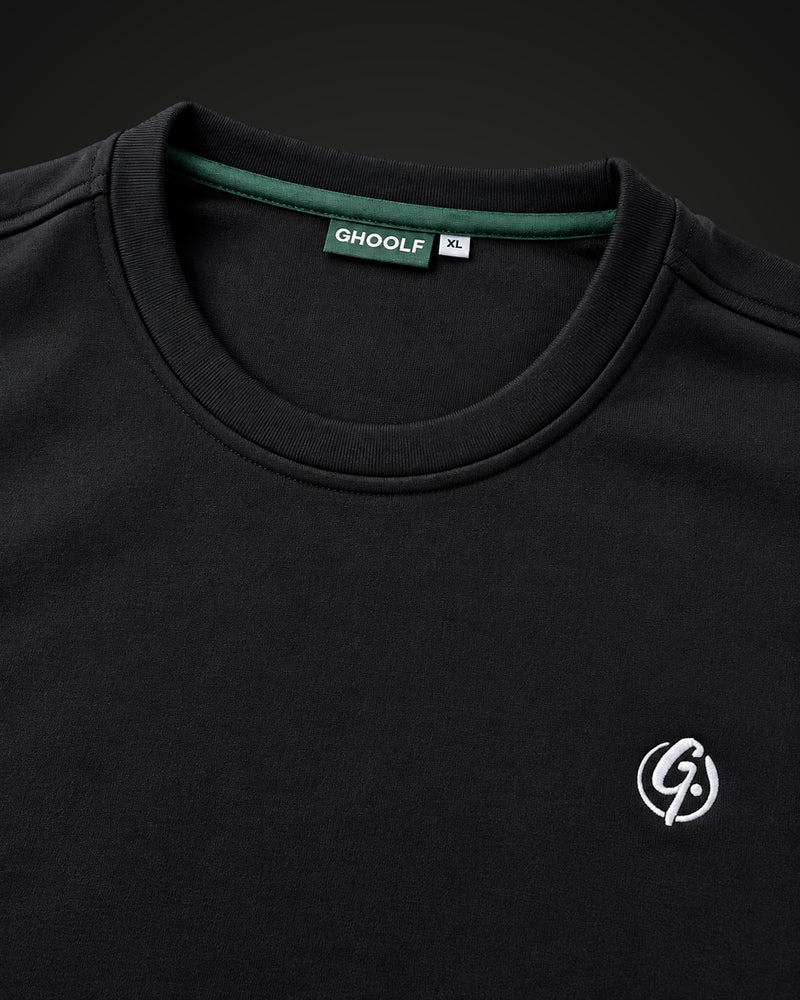 Crew collar with forest green inner trim, neck label and embroidered signet
