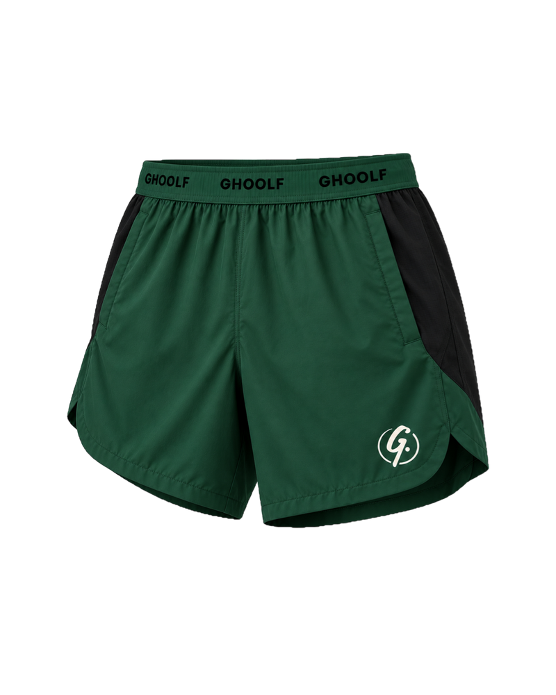 Forest green Ghoolf sport shorts with black side panels, three-quarter view, with split curved hem