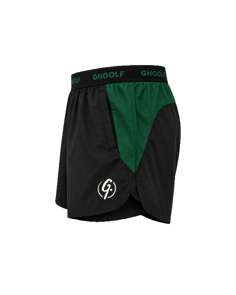 Black Ghoolf sport shorts with forest green side panels, side view, with signet at the hem