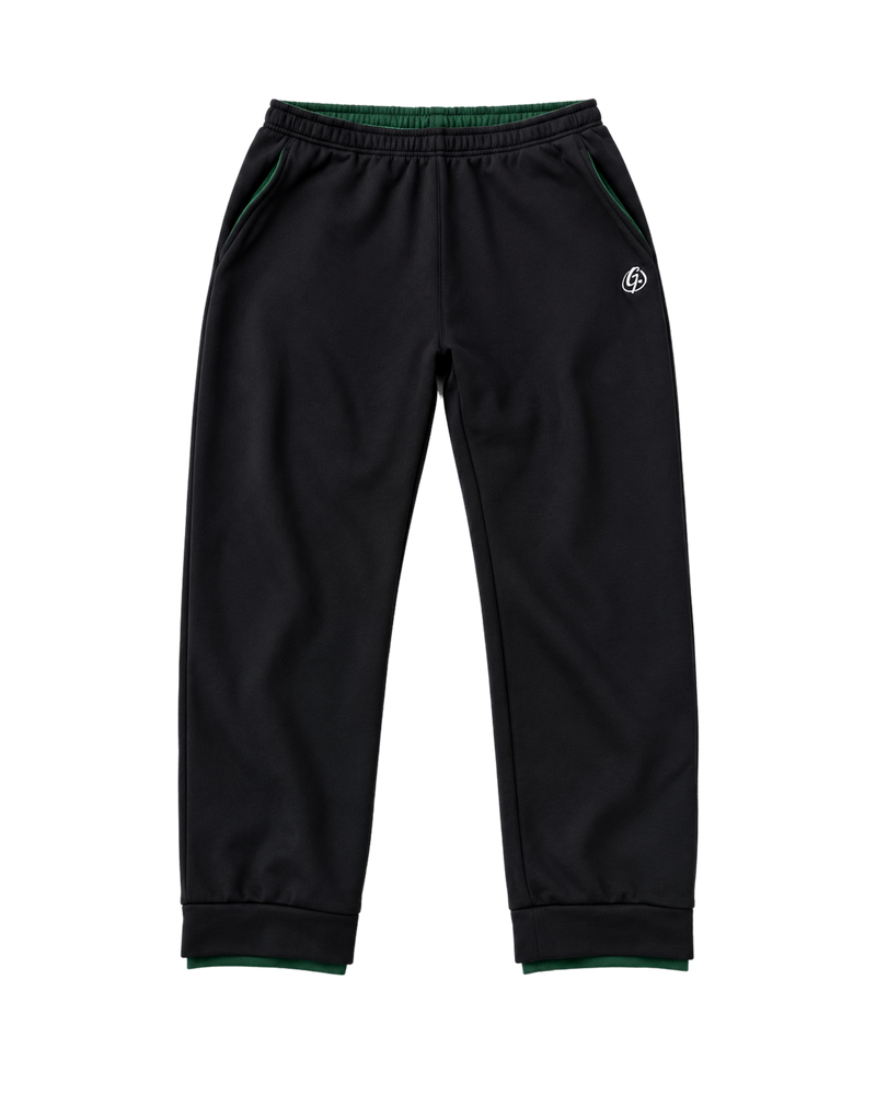 Black Ghoolf sweatpants, front, with white signet at the hip and forest green waistband lining