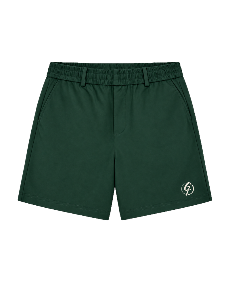 Forest green Ghoolf tailored shorts, front, with belt loops and ivory signet at the hem