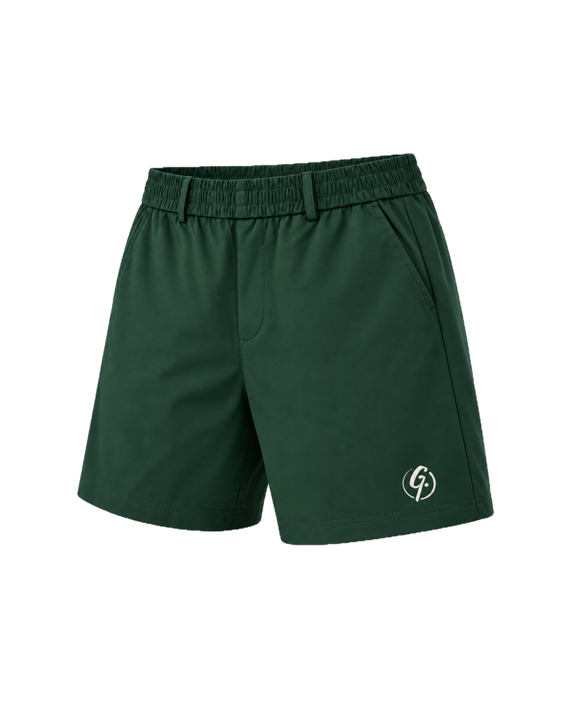 Forest green Ghoolf tailored shorts, three-quarter view, with slanted front pocket and signet at the hem