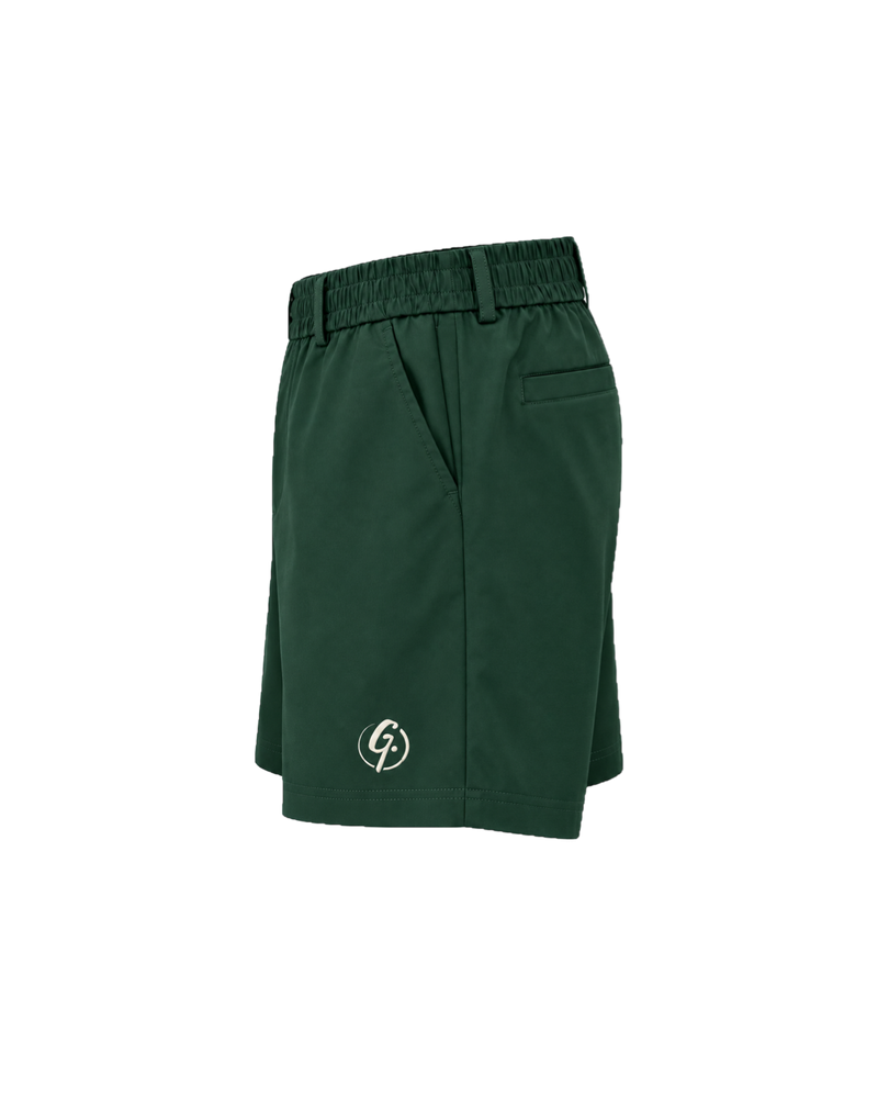 Forest green Ghoolf tailored shorts, side view, with slanted pocket and elastic waistband