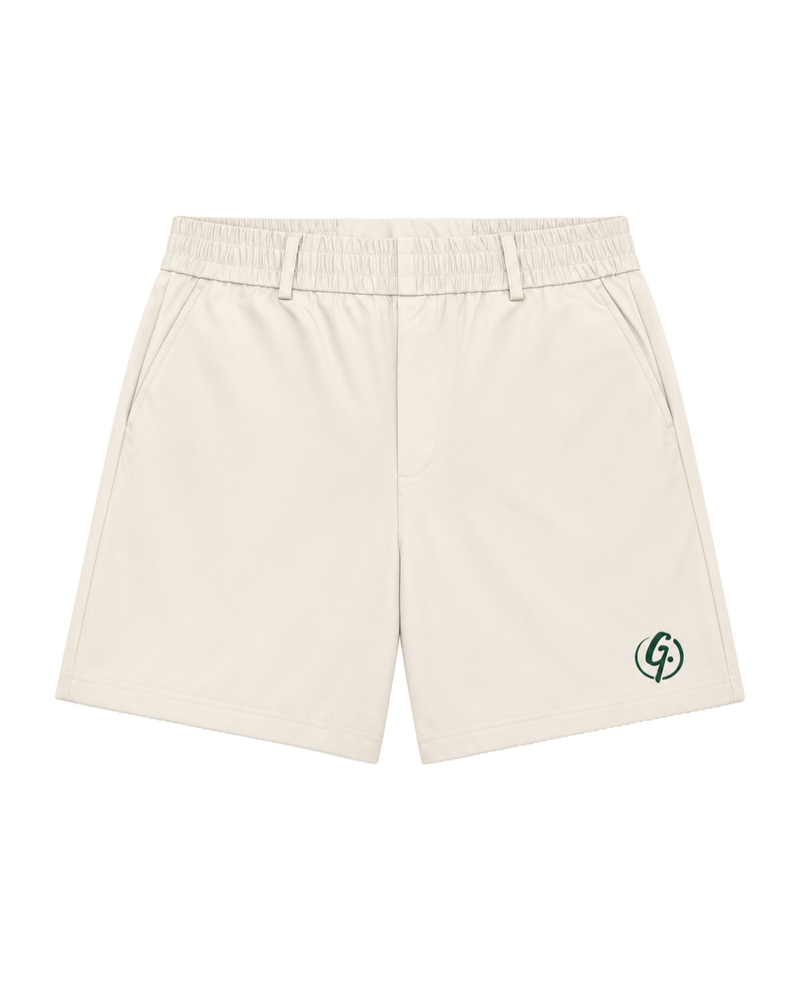 Ivory Ghoolf tailored shorts, front, with belt loops and forest green signet at the hem